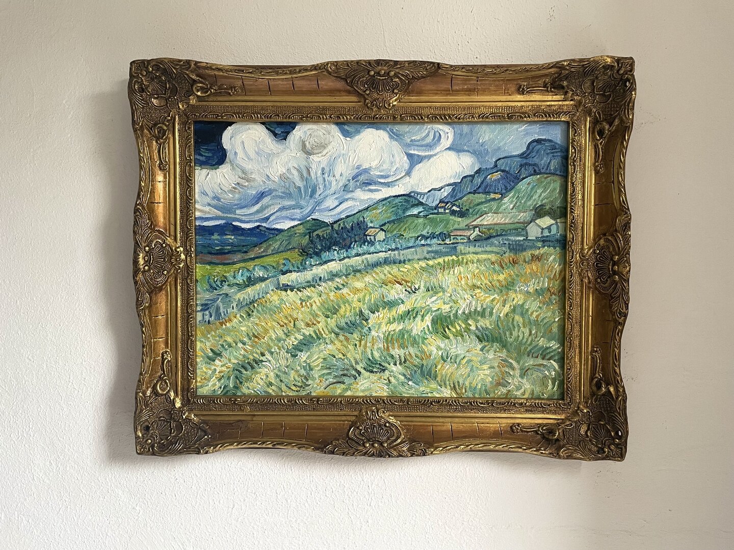 small replica of Van Gogh's Mountain Landscape behind the Saint-Paul Hospital with Louis XVI frame